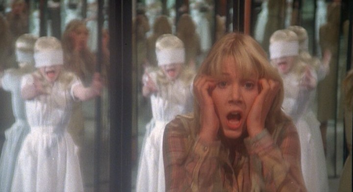 THE WATCHER IN THE WOODS (1980) Lynn-Holly Johnson is looking at the women in the mirror